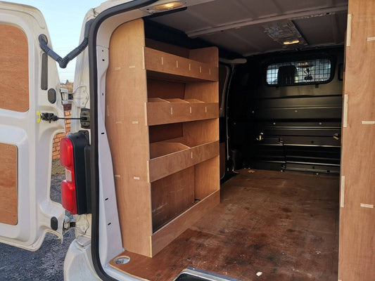 CNC Design rear van racking with plywood shelving inside a Citroen Dispatch MWB van for efficient storage and organization.
