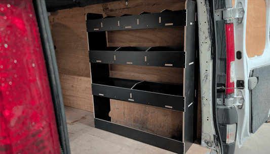 Vauxhall Vivaro SWB van 2014-2018 in white with side sliding door and Vauxhall branding, parked on a city street.