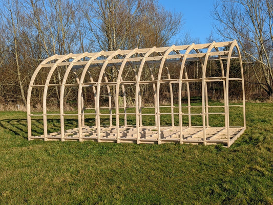 Shropshire CNC glamping pod frame kit showing modular building components, 3.2m wide with wooden beams and metal connectors.