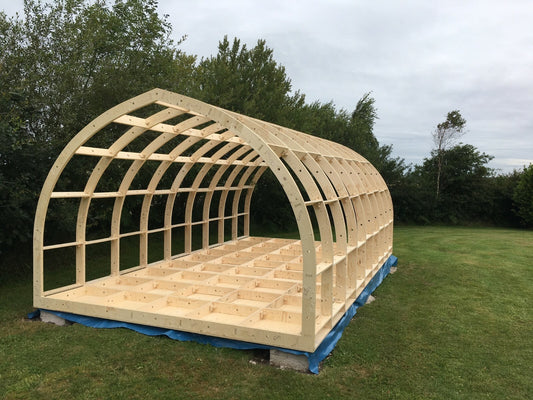 Shropshire CNC glamping pod frame kit in wide 7.2m x 3.5m modular building with metal framework and construction components.