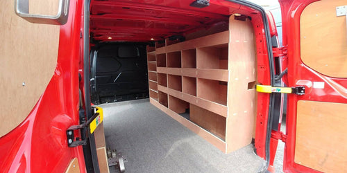 Ford Custom van racking with plywood shelving and deep storage, including drill and service case in LWB van for commercial vehicle organization.
