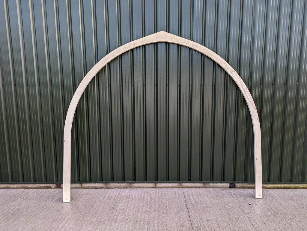 Shropshire CNC glamping pod frame arch, 3.2m modular building structure with metal arch and wooden panels for outdoor accommodation.
