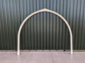 Shropshire CNC glamping pod frame arch, 3.2m modular building structure with metal arch and wooden panels for outdoor accommodation.