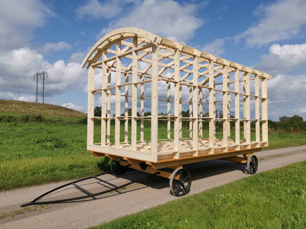 Shropshire CNC Shepherd's Hut Frame Kit showing assembled wooden structure with roof and walls for modular building project.