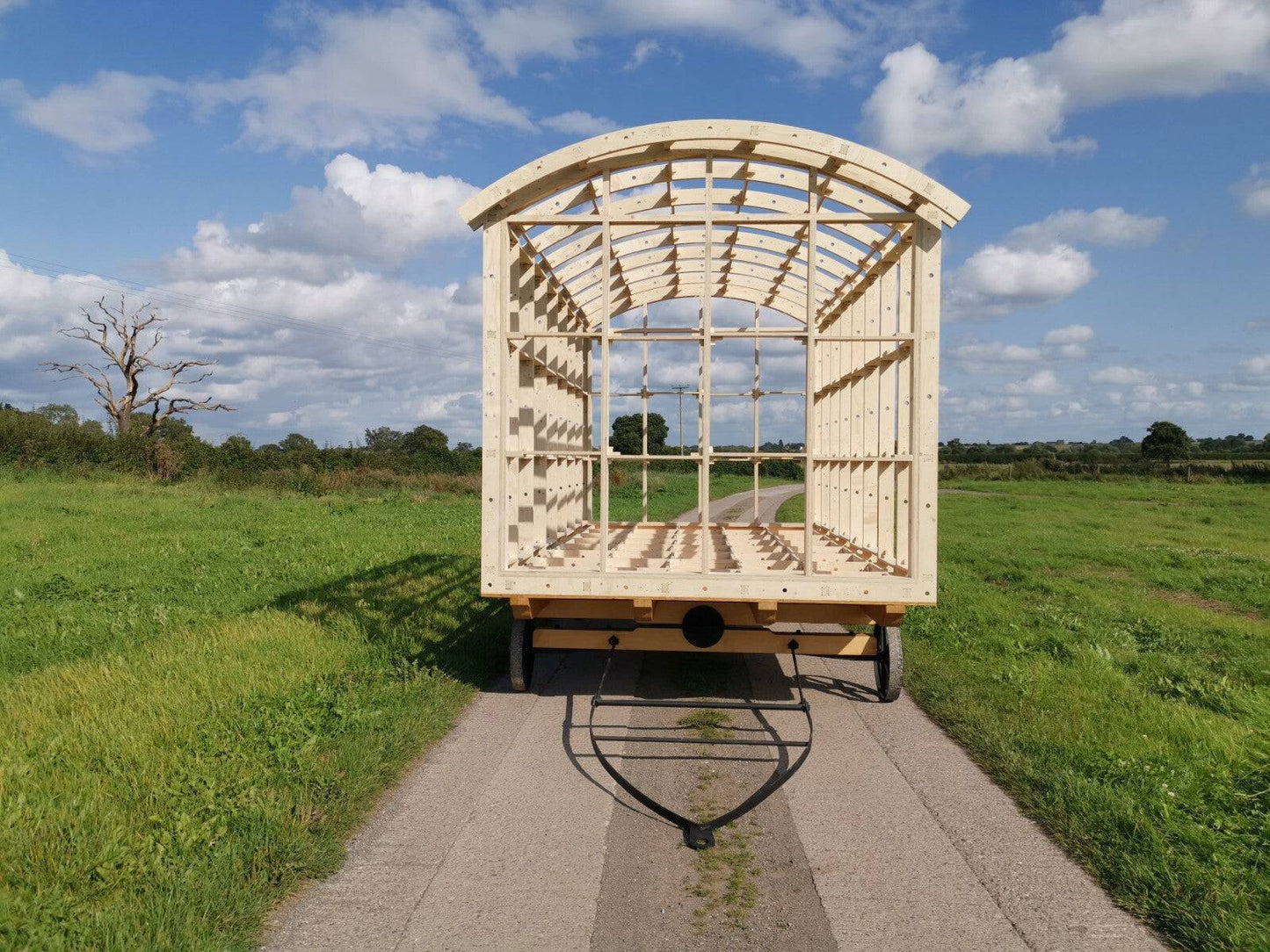 Shropshire CNC shepherds hut frame kit shown in modular building, 6m long, 2.6m wide, with wooden structural components.