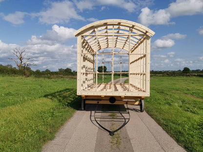 Shropshire CNC shepherds hut frame kit shown in modular building, 6m long, 2.6m wide, with wooden structural components.