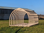 Shropshire CNC XL glamping pod frame kit, modular building structure with wooden beams, measuring 6.0m by 2.95m, ready for assembly.