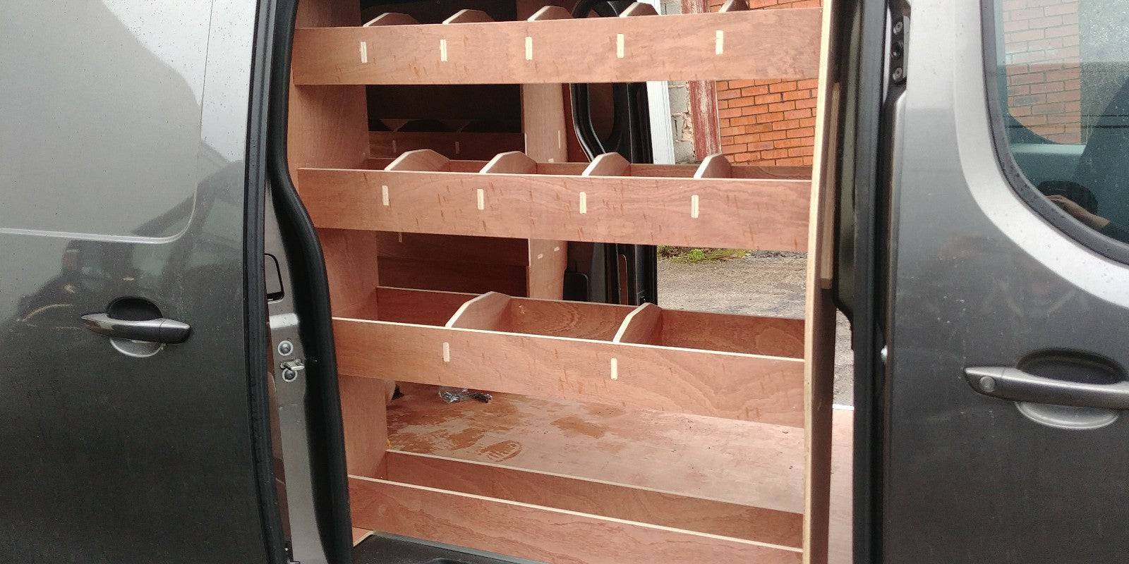 Vauxhall Vivaro MWB 2019 van racking with plywood shelves and storage compartments for commercial vehicle organization.