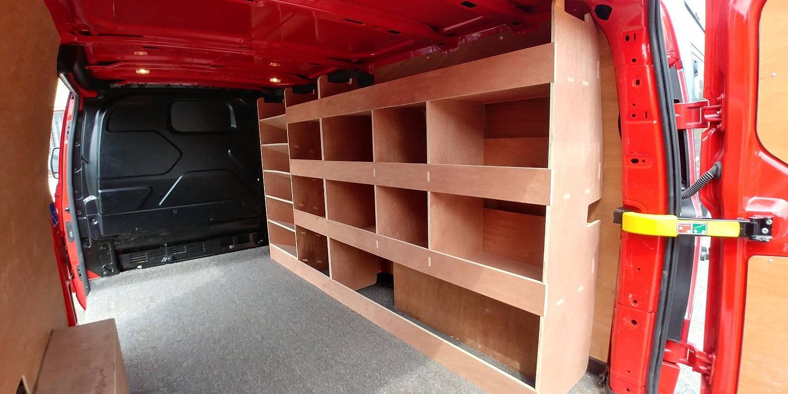 Ford Custom van racking with plywood shelving and deep storage case installed in a long wheelbase van interior.