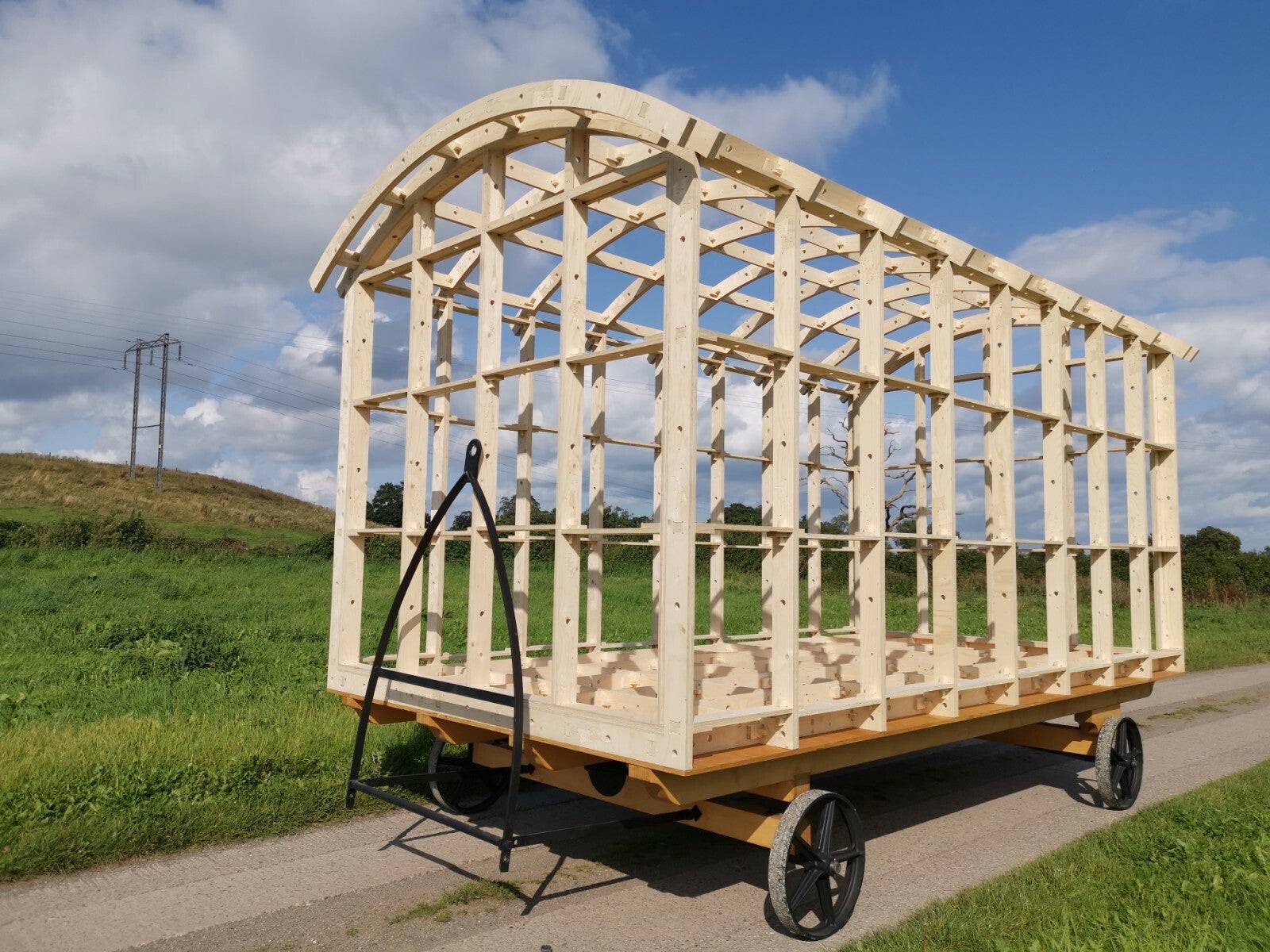 Shropshire CNC shepherd's hut frame kit showing modular construction with wooden beams and structure dimensions.