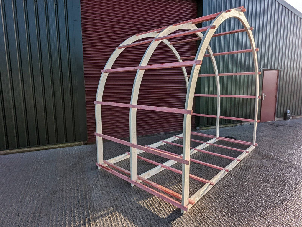 Shropshire CNC glamping pod frame arch kit measuring 3.2 meters, modular building structure with metal components and assembly parts.