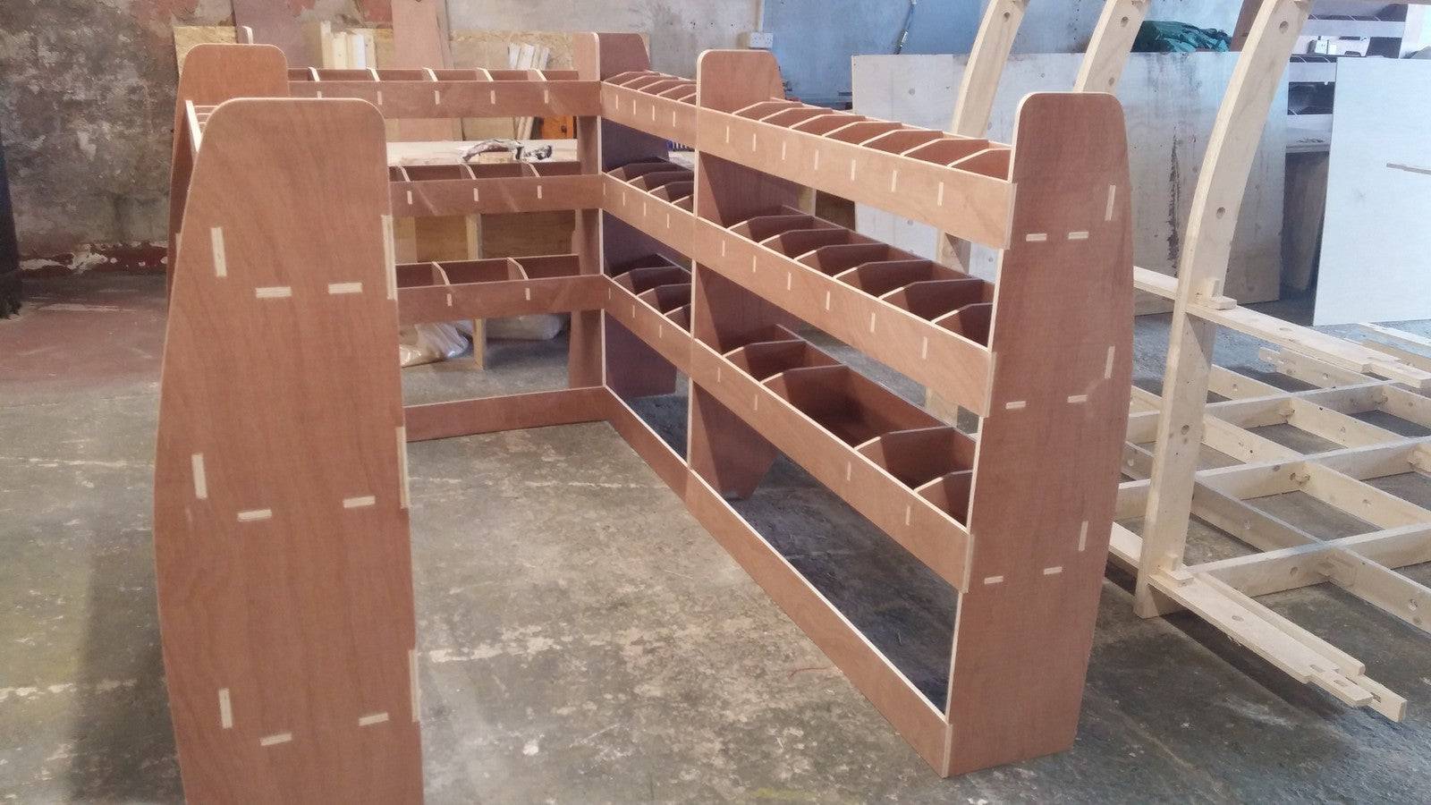 Volkswagen Transporter T5 LWB van racking with plywood shelves and storage compartments for commercial van organization