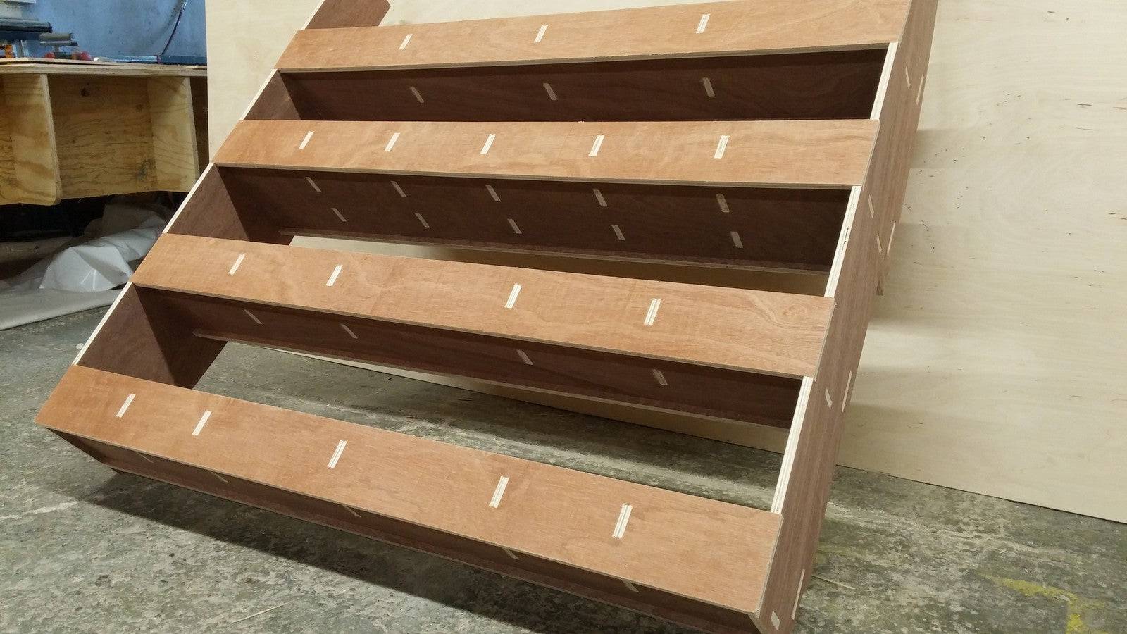 Peugeot Partner van racking with plywood shelving for tool storage in the cargo area, designed for commercial vehicle organization.