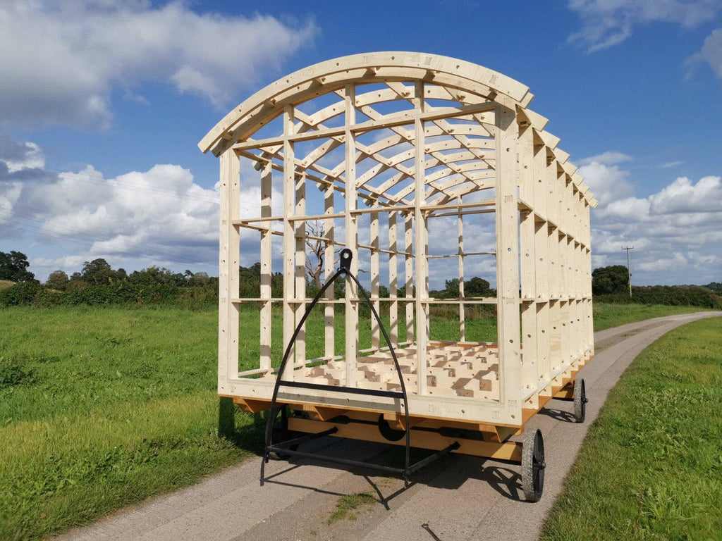 Shropshire CNC shepherd's hut frame kit with metal structural beams, measuring 4.2m long, 2.59m wide, and 2.668m high, ready for assembly.