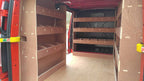 Ford Transit Custom SWB van shelving and racking system, organized tool storage for commercial vehicle interior.