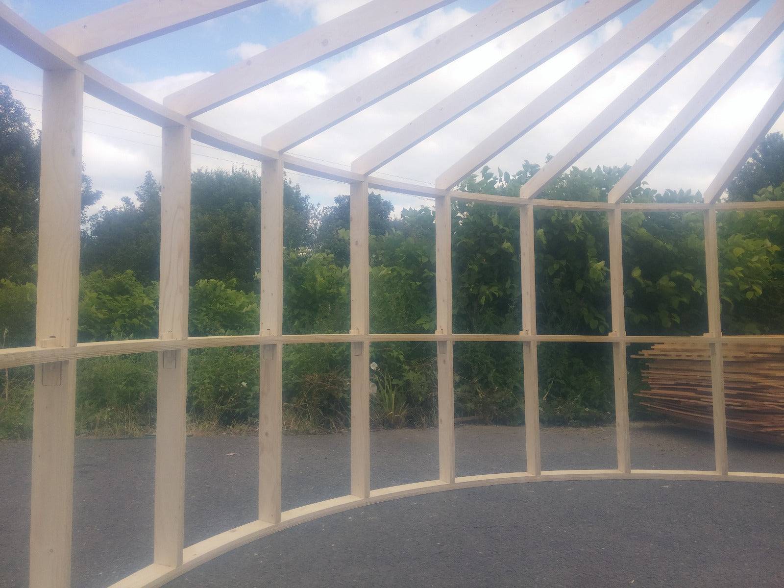 Shropshire CNC 4.2m Yurt Pod Frame Kit showing modular building structure with wooden framework and metal connectors.