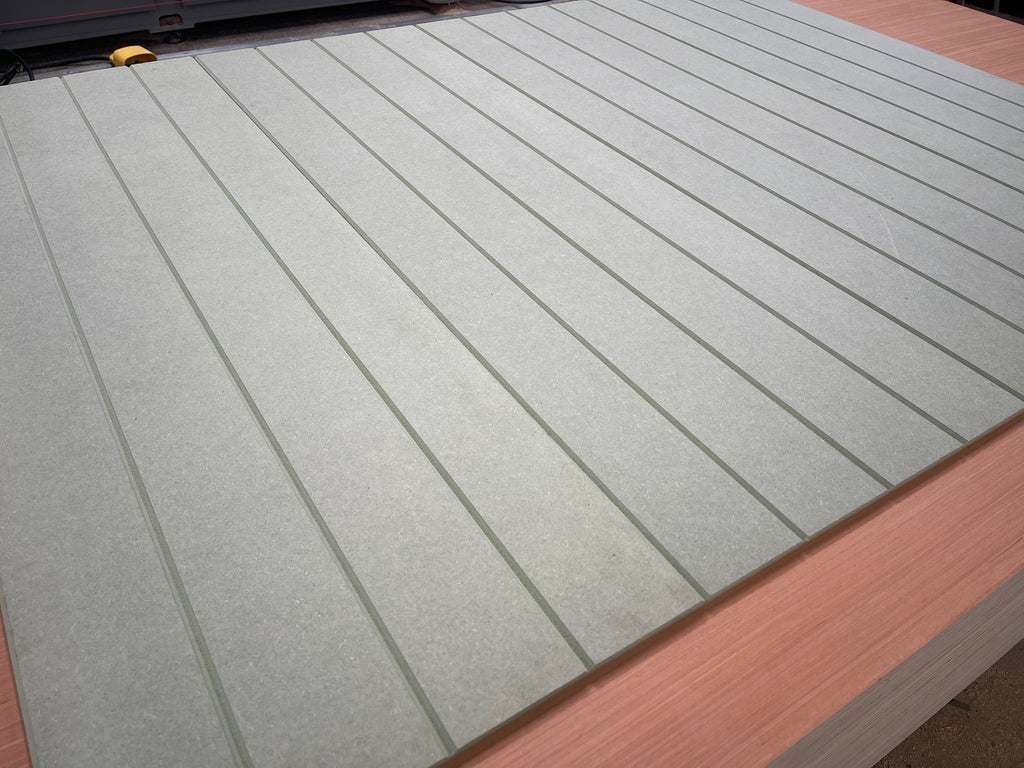 Shropshire CNC MDF 6mm V Groove Wall Panel Kit showing assembled wood panels with V-groove design on a wall.