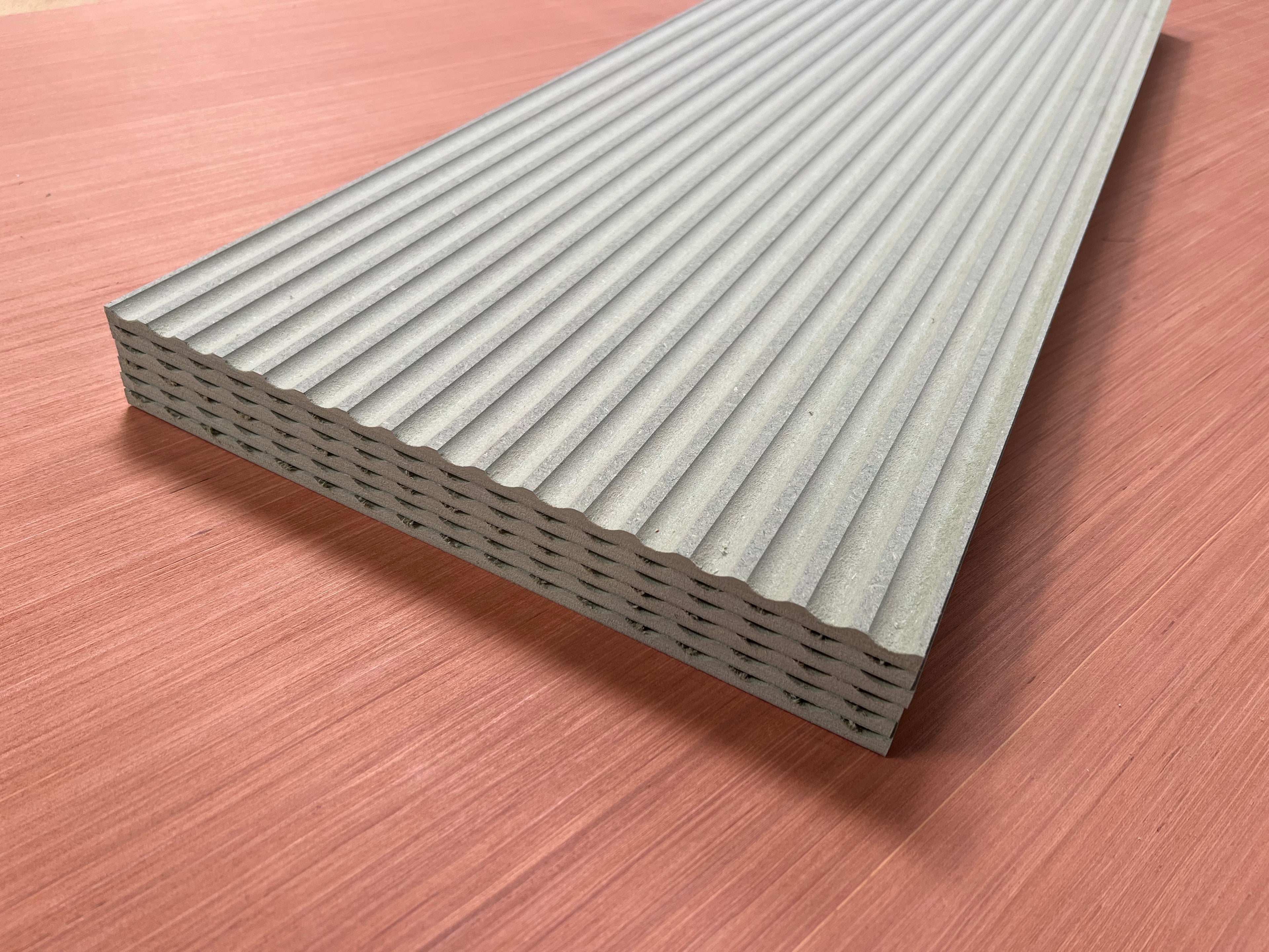 Shropshire CNC MDF 9mm fluted wall panel kit with multiple textured gray panels arranged in a modern interior setting