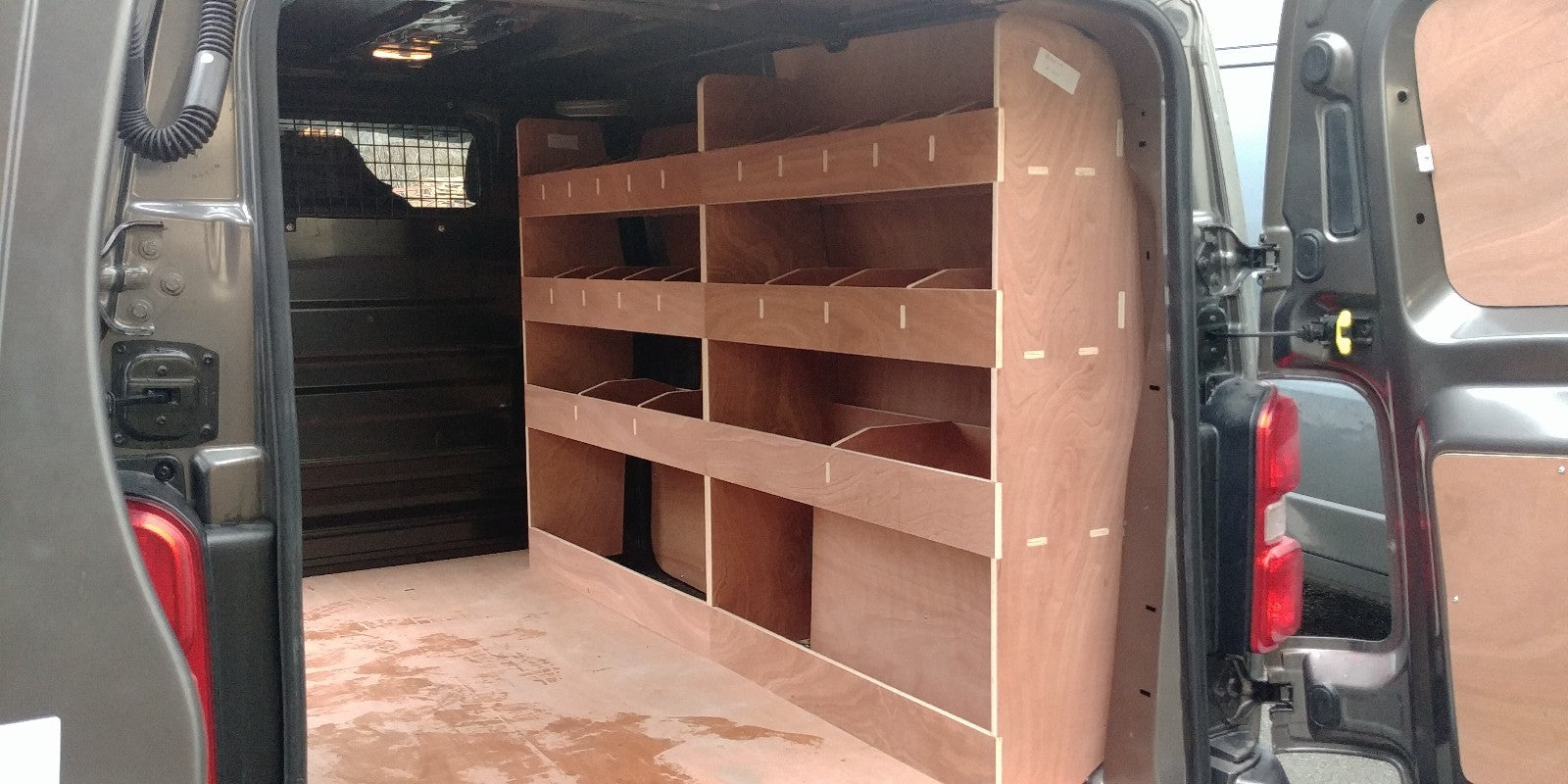 Citroen Dispatch MWB late 2016 van racking with plywood shelving for commercial vehicle storage and organization.