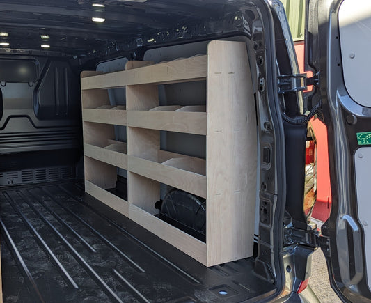 Ford Custom 2024 van racking with double unit shelving, organized tool storage inside a commercial vehicle.