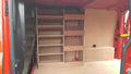 Ford Custom van racking with plywood shelving and deep storage drill/service case for commercial van organization.