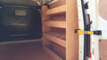 Ford Custom LWB Van racking with plywood shelving, storage accessories, and tools for commercial vehicle organization.