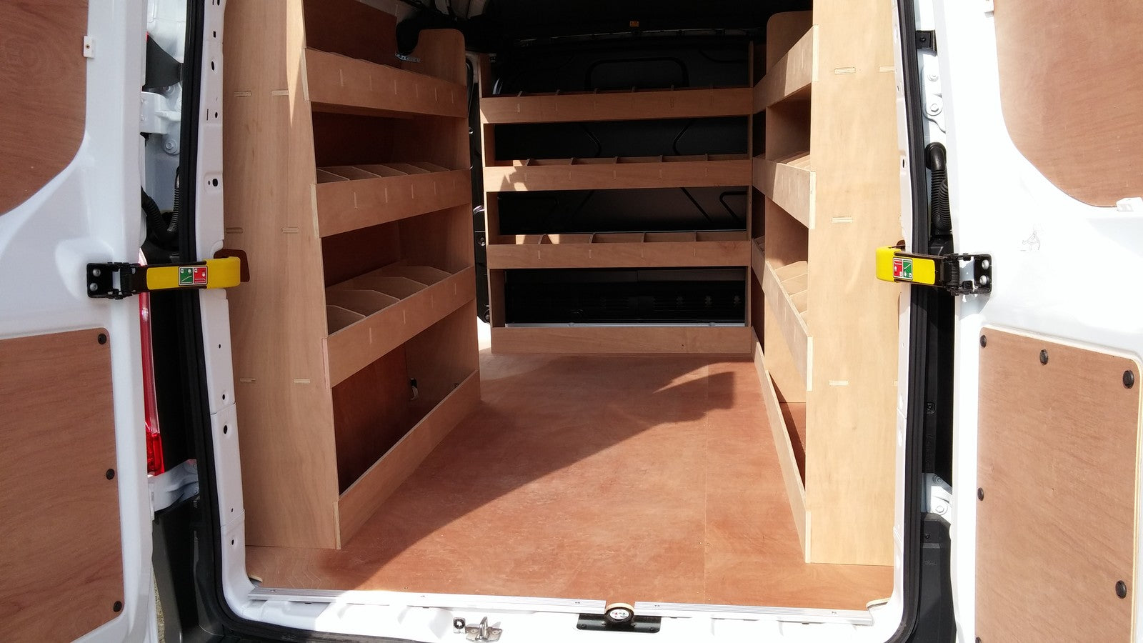 Ford Transit Custom LWB van racking with plywood shelving and storage organiser for commercial vehicle van organization.