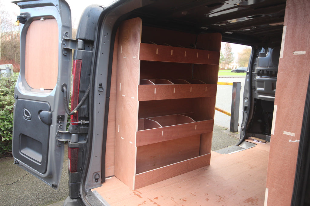 Nissan NV300 SWB 2015 van with triple unit plywood shelving and van racking installed in the cargo area.