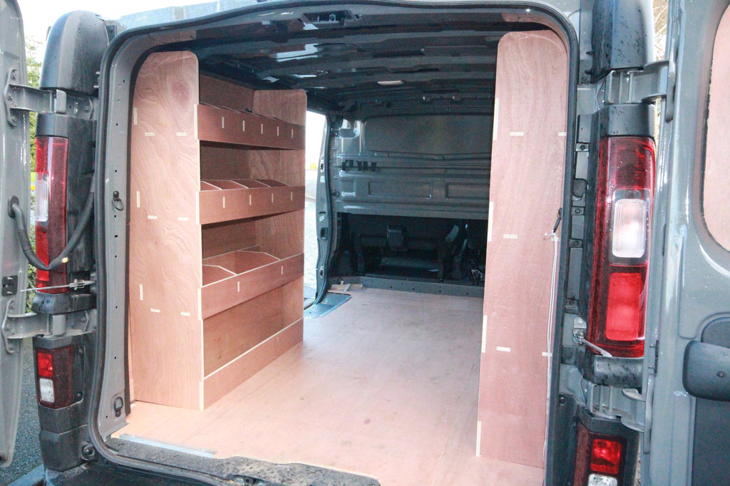 Nissan NV300 SWB 2015 van with triple unit plywood shelving van racking system for commercial vehicle storage.