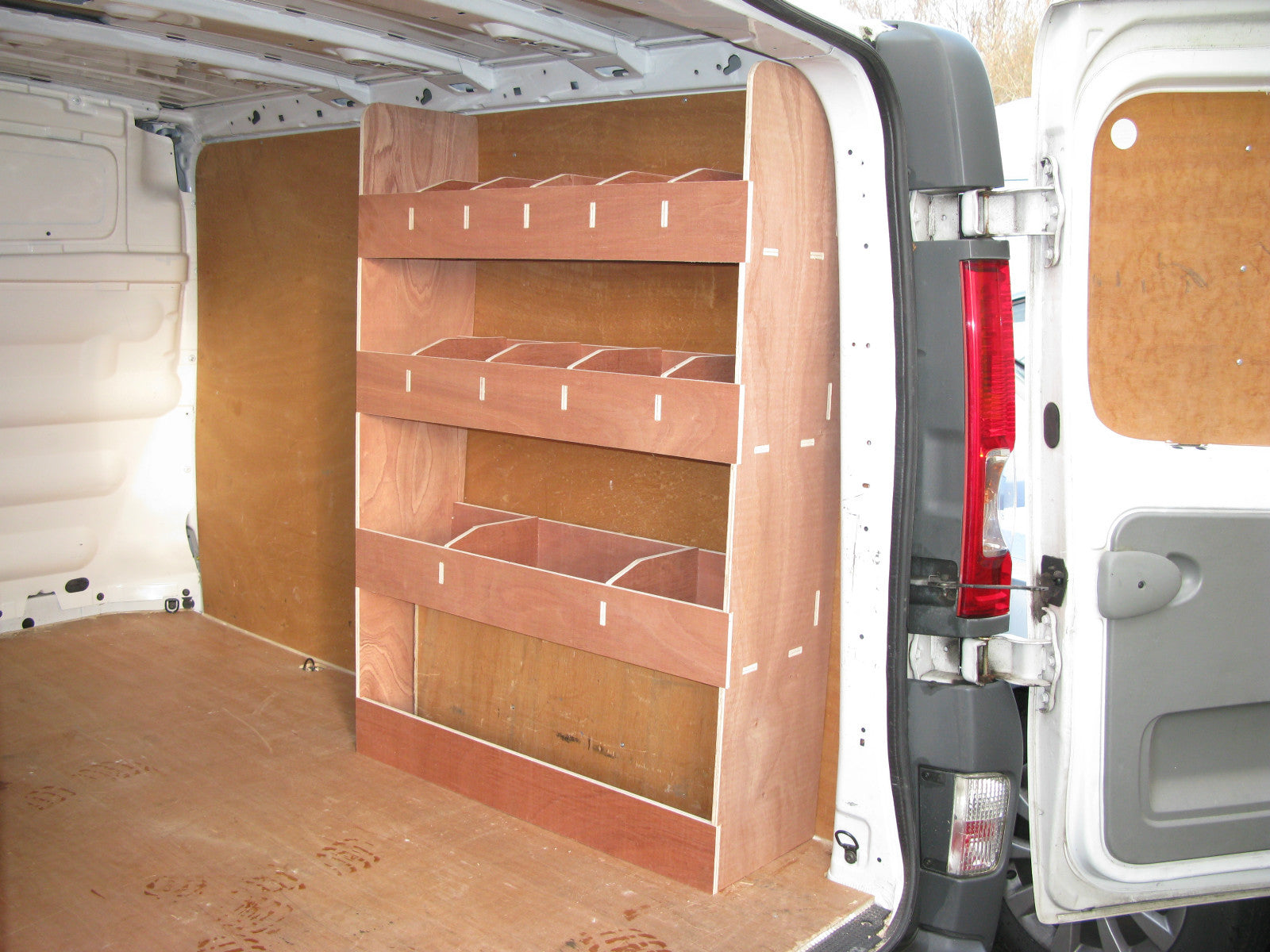 Renault Trafic SWB Van 2008-2013 with plywood van racking and shelving for commercial vehicle organization.