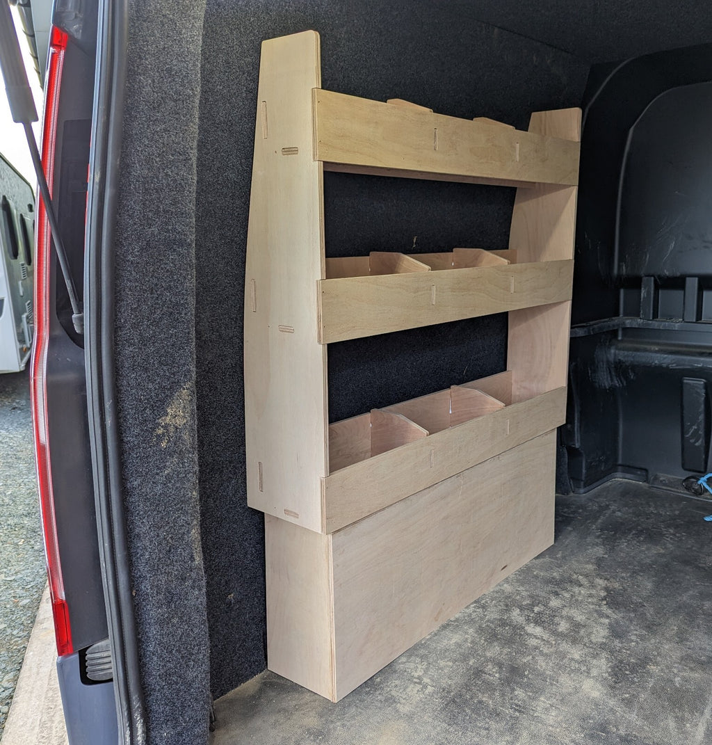 RS Ford Transit Custom plywood van shelving with over wheel box storage for tool organization in commercial vehicle van.