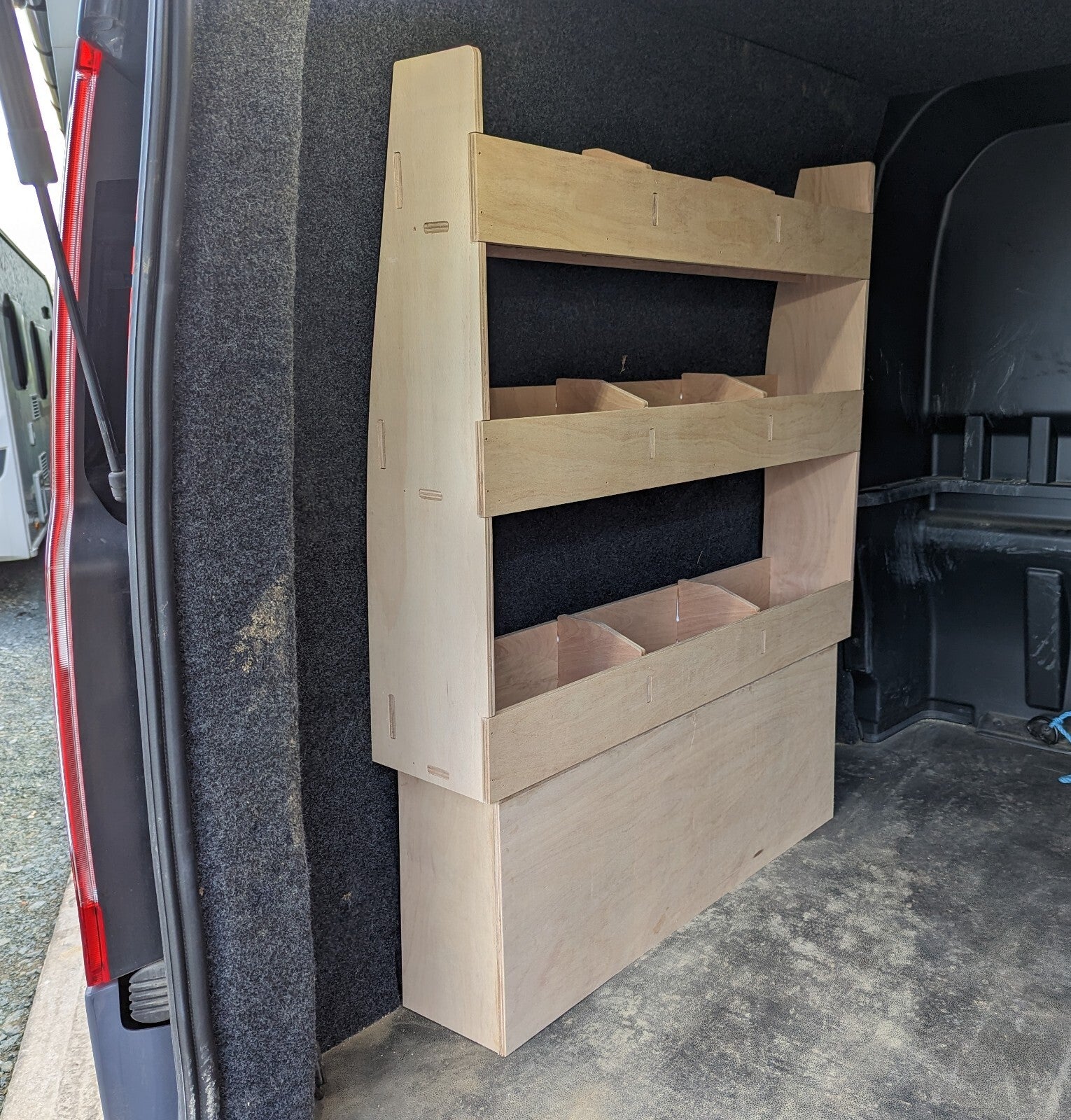 RS Ford Transit Custom plywood van shelving with over wheel box storage for tool organization in commercial vehicle van.