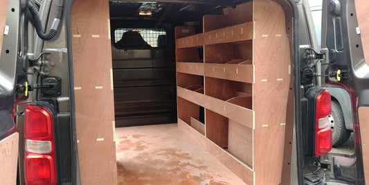 RS Vauxhall Vivaro MWB 2019 van racking with triple plywood shelving for efficient cargo organization inside a commercial van.