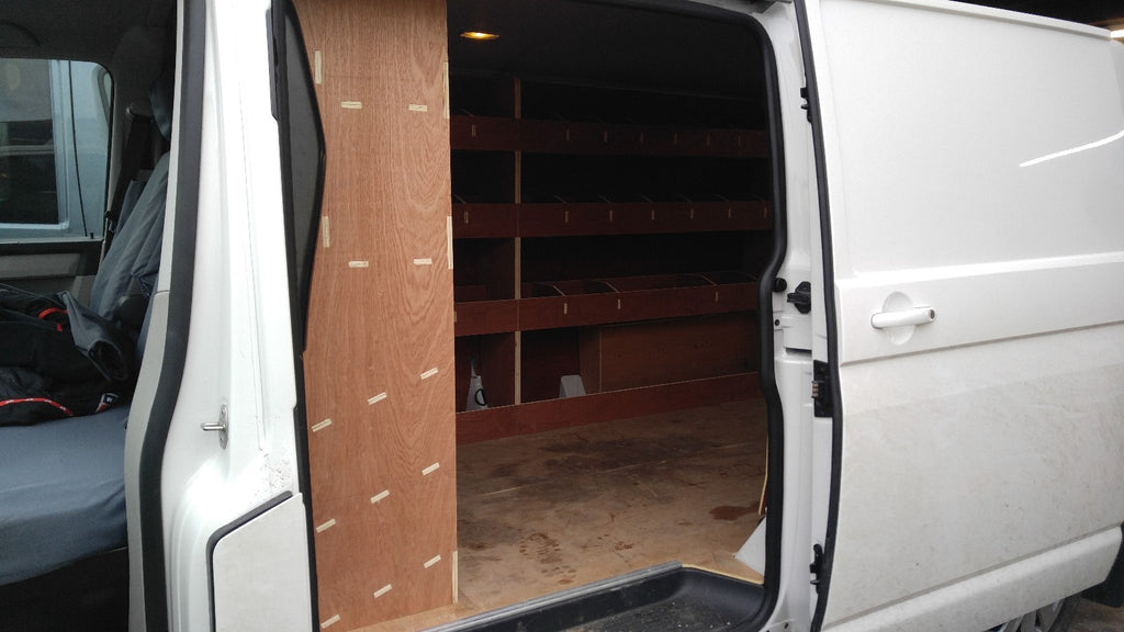 RS VW T5 T6 SWB triple van racking with plywood shelves for storage in commercial vehicle van or pickup interior.