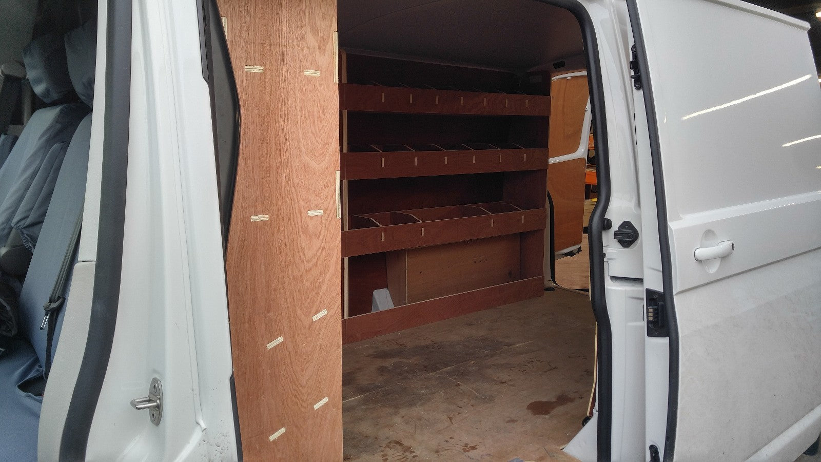 RS VW T5 T6 SWB triple van racking with plywood shelving for storage in commercial van or pickup vehicle.