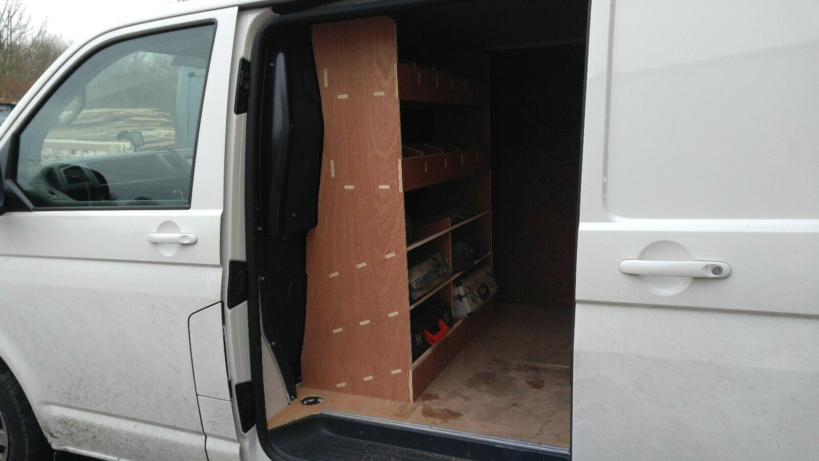 RS VW Transporter T5 T6 van shelving racking and tool storage organiser in the vehicle cargo area.