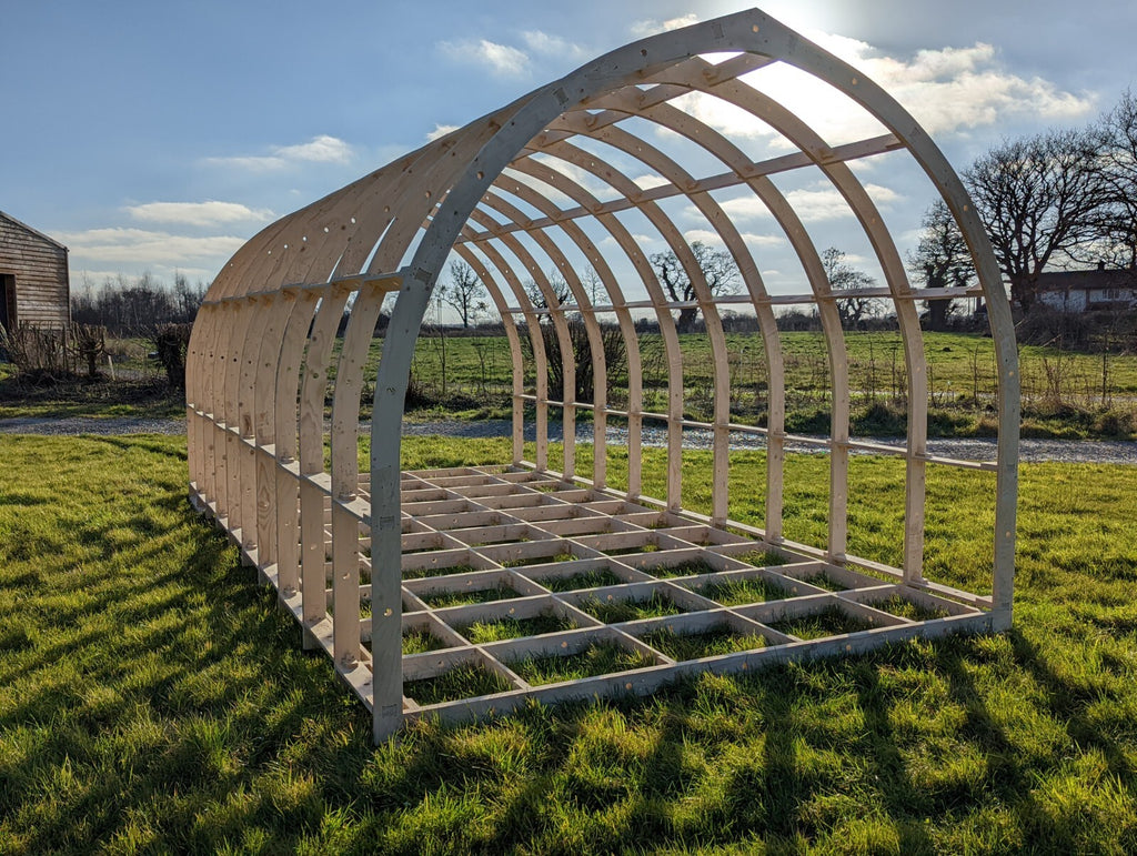 Shropshire CNC glamping pod frame kit, 3.2m wide, modular building structure with wooden framing for outdoor accommodation.