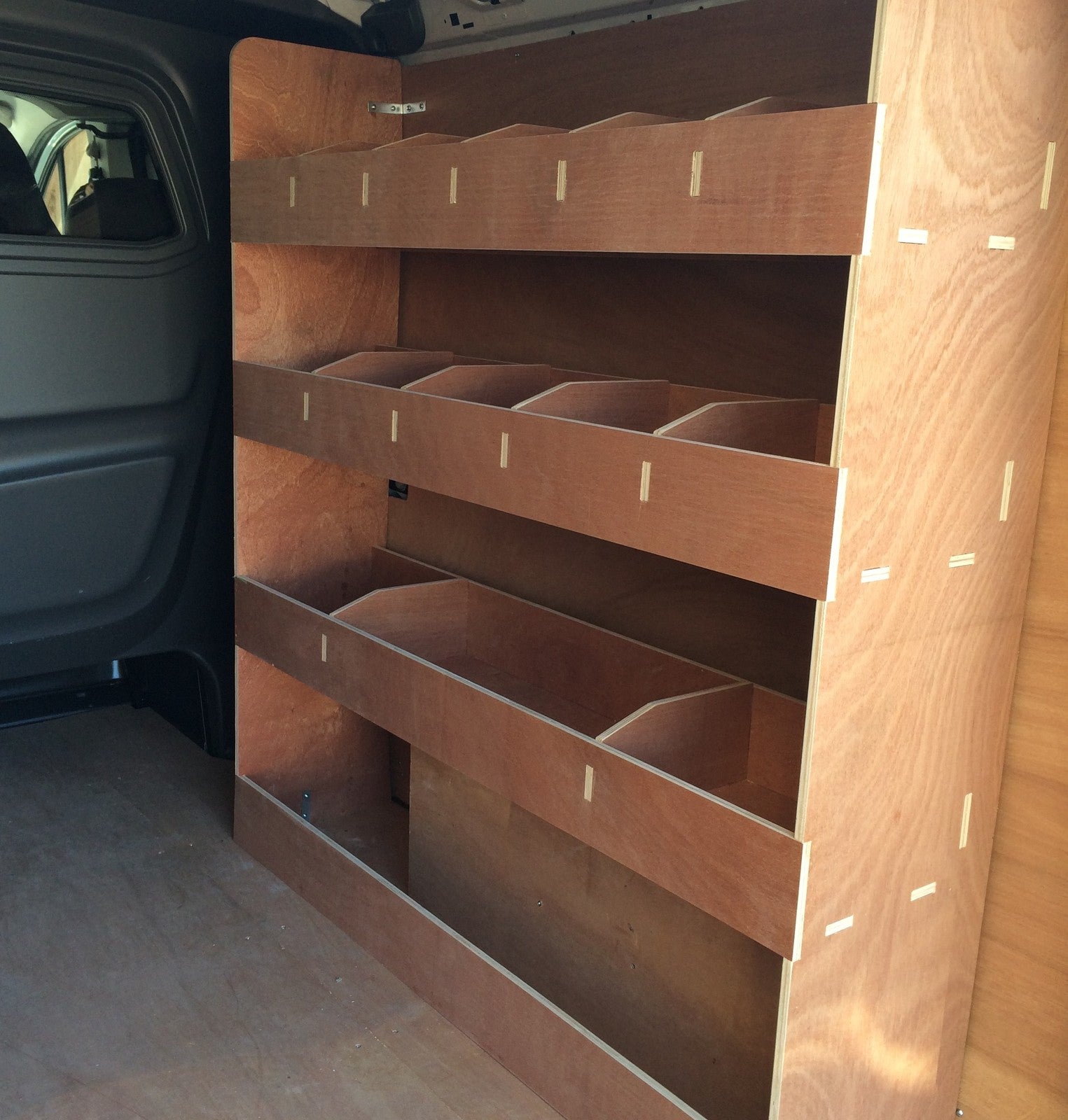 Vauxhall Vivaro LWB Crew Cab 2015 van with plywood shelving and organizer inside for commercial vehicle storage.