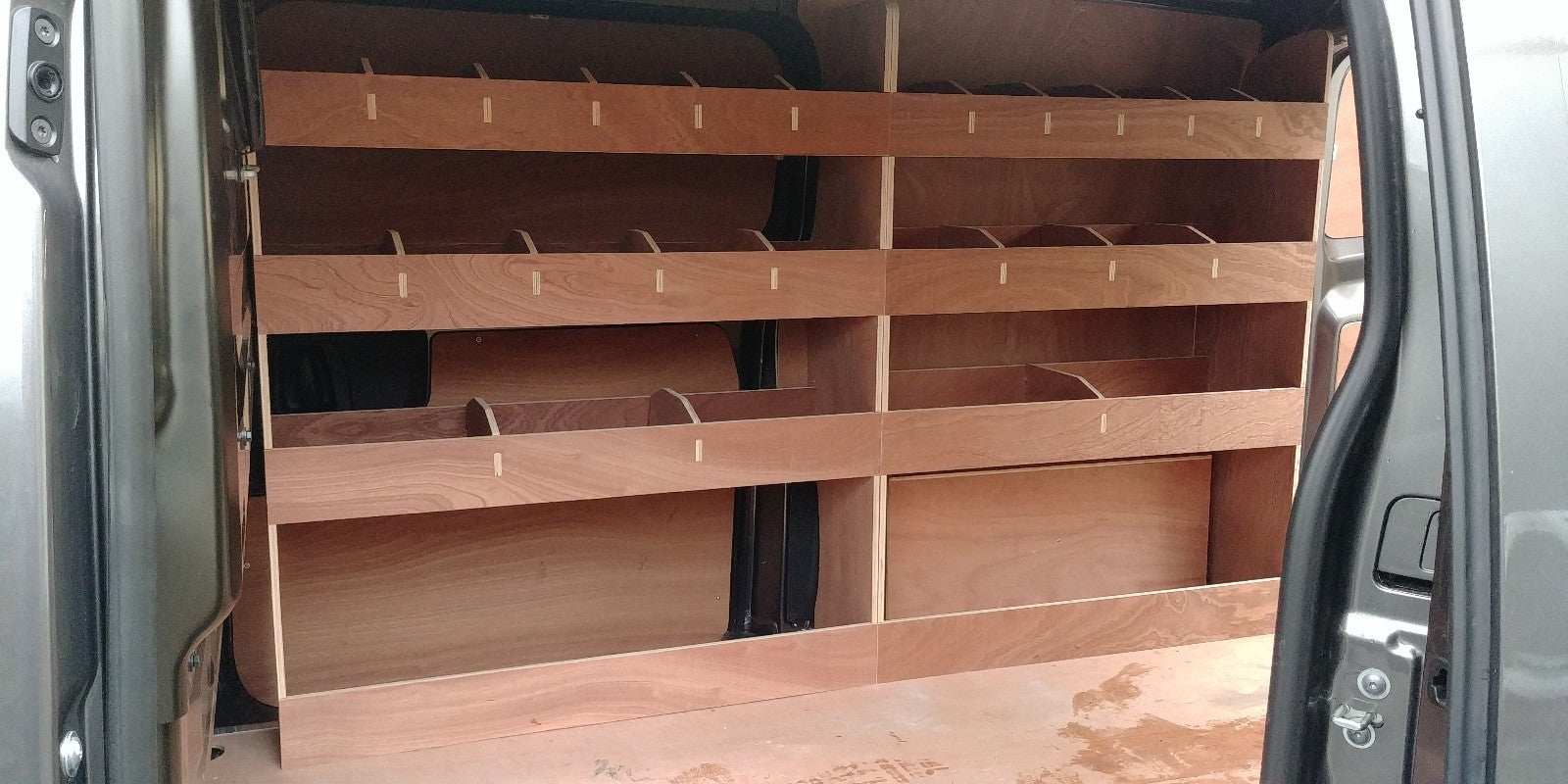 Vauxhall Vivaro LWB 2019 van racking with plywood shelving and storage for commercial vehicle organization.