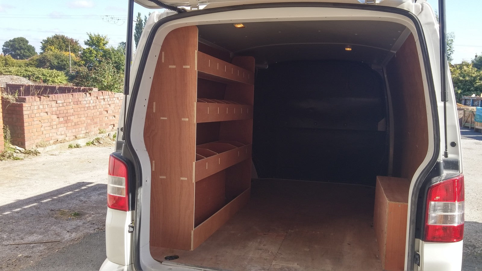 VW T5/T6 Transporter LWB van racking with plywood shelves for storage and organization inside the commercial vehicle.