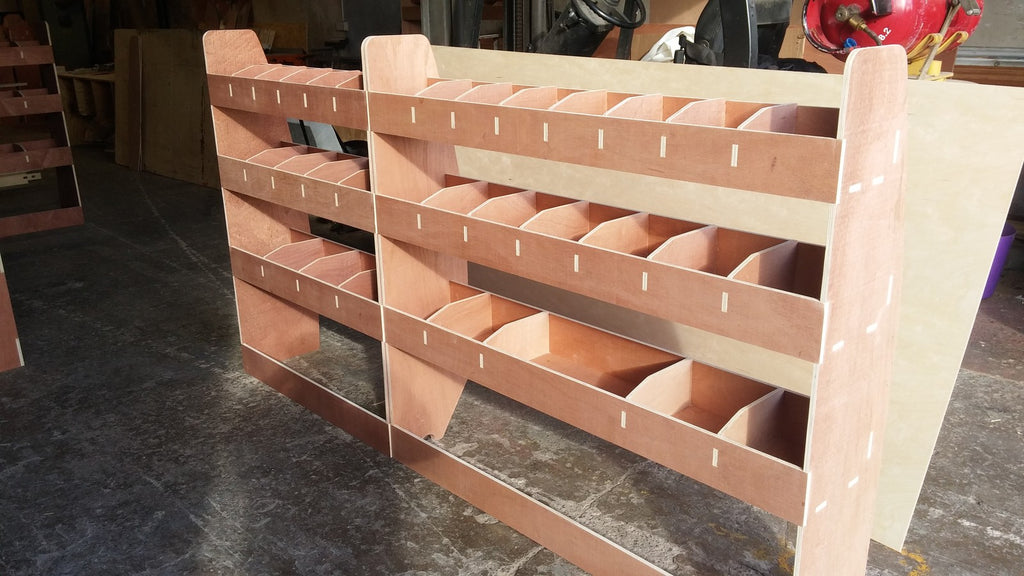 VW T5 Transporter LWB van racking with plywood shelving for organized storage and vehicle interior organization.