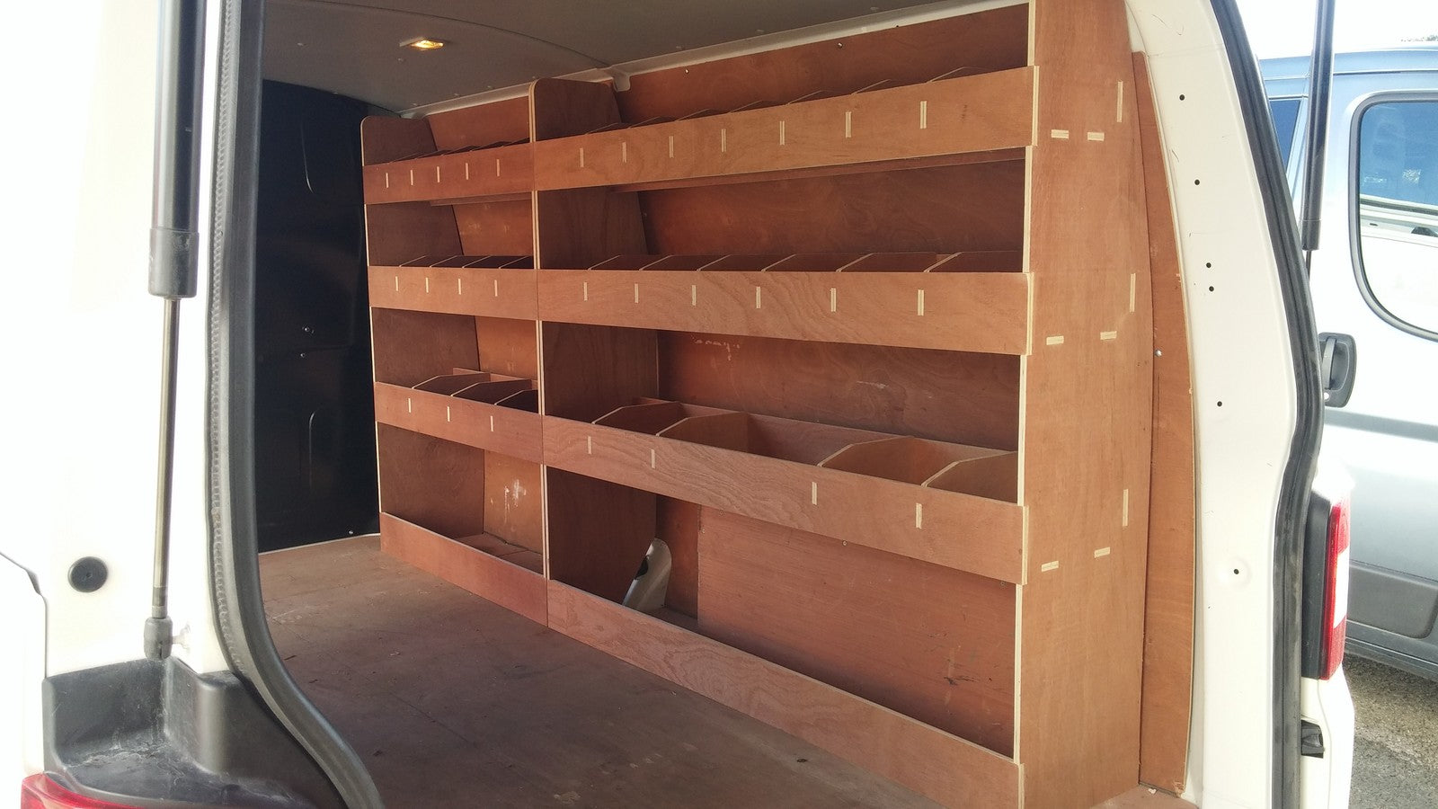 VW T5 T6 Transporter LWB van racking with plywood shelving and storage organiser for commercial vehicle organisation.
