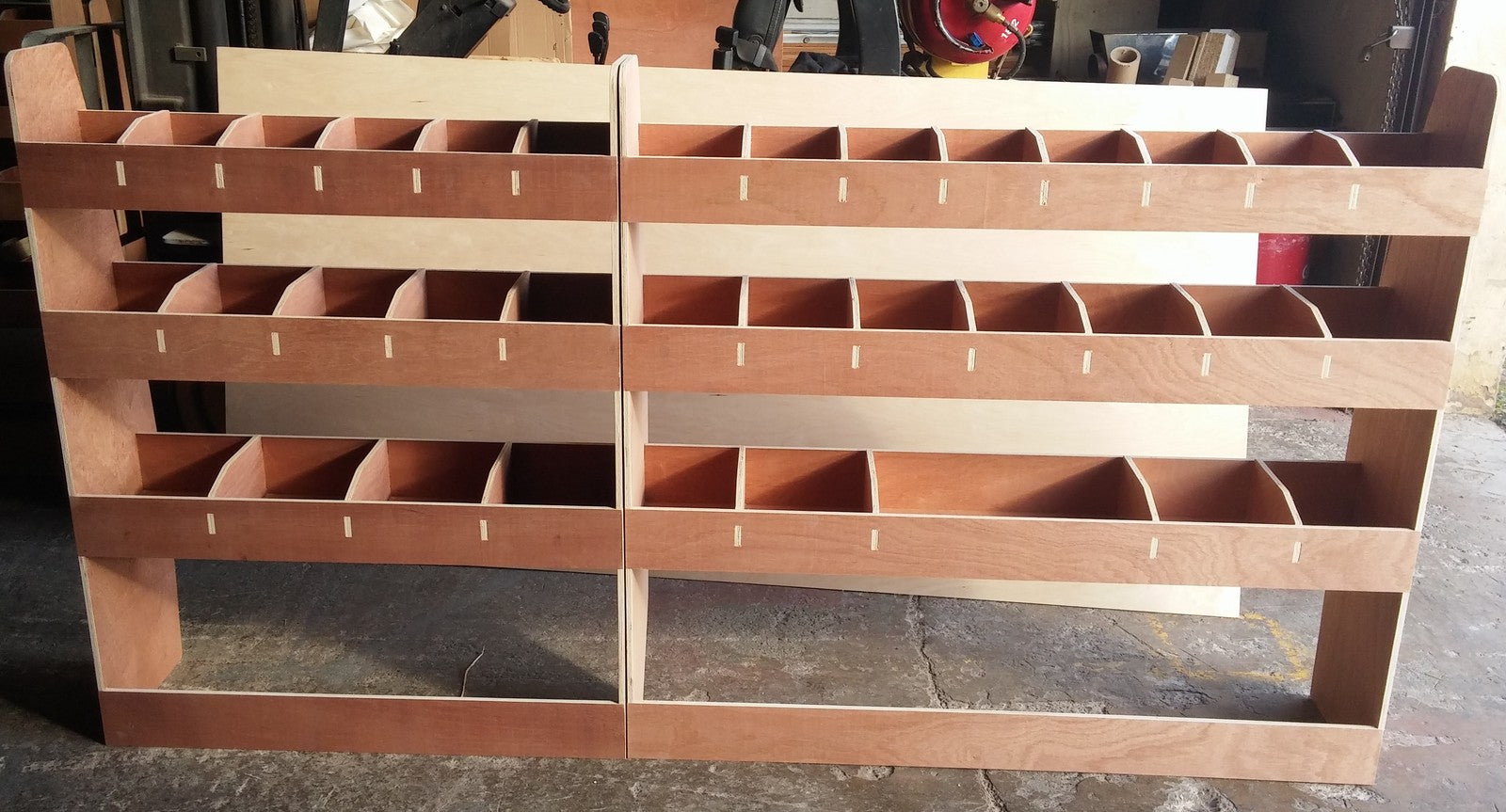 VW T5 T6 Transporter LWB van racking with plywood shelving for storage and organization of commercial vehicle parts.