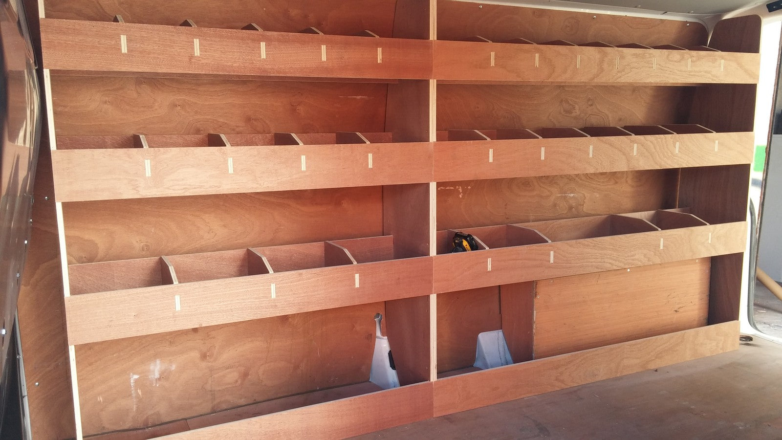 VW T6 Transporter LWB van racking with plywood shelving for storage, vehicle accessories, ideal for commercial van organization.
