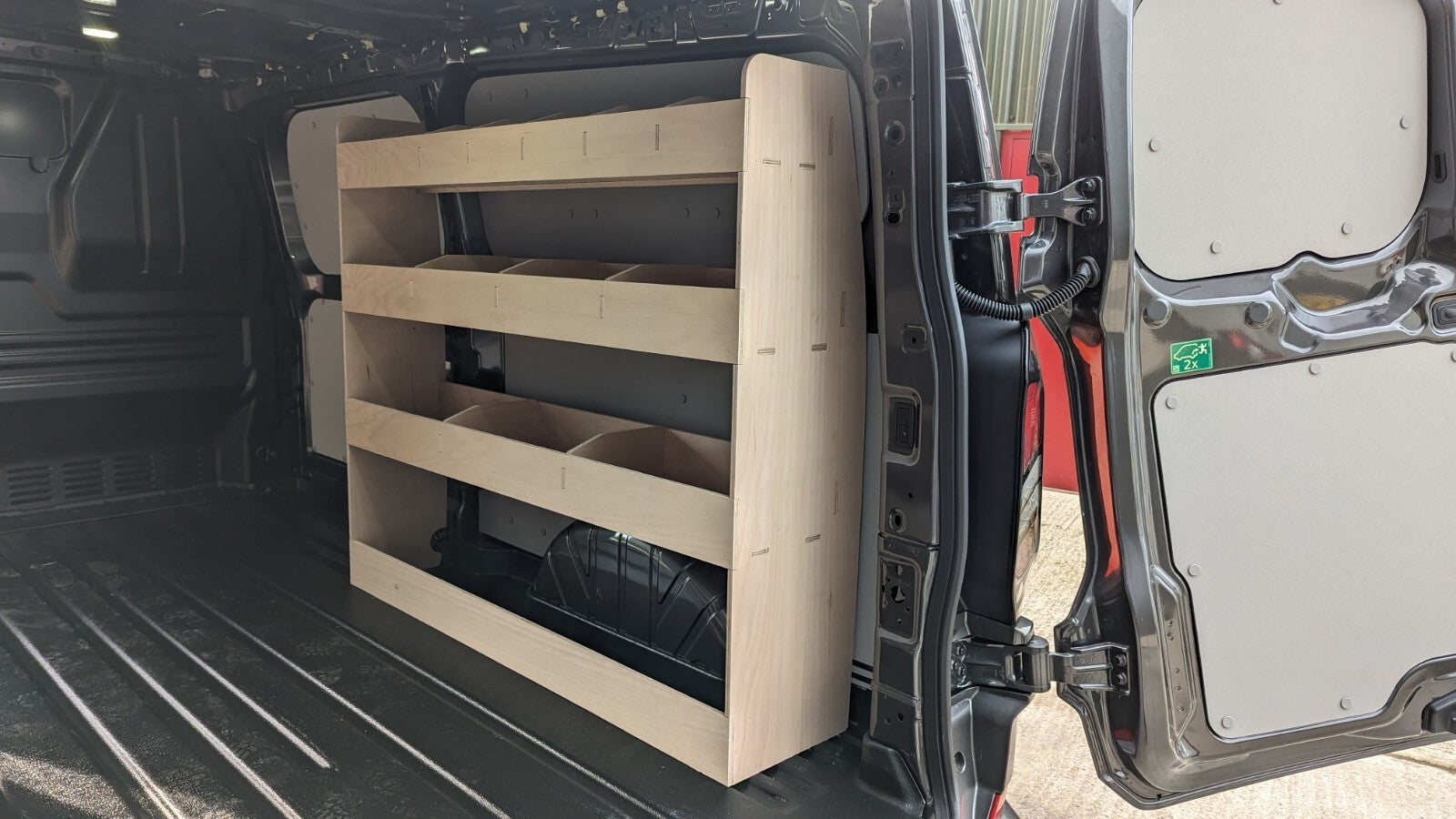 VW Transporter T7 LWB Van Rack Tool Organizer for commercial vehicle vans, mounted on the side of the van for easy access.
